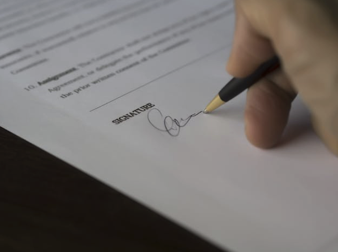 Person signing a contract